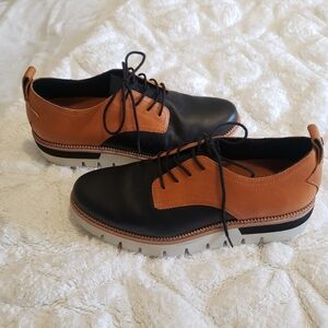 CAT BROWN-BLACK LOAFERS...SIZE:7 1/2 W GREAT CONDITION